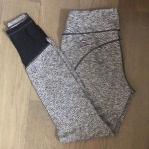 Heather grey leggings with black mesh at ankle